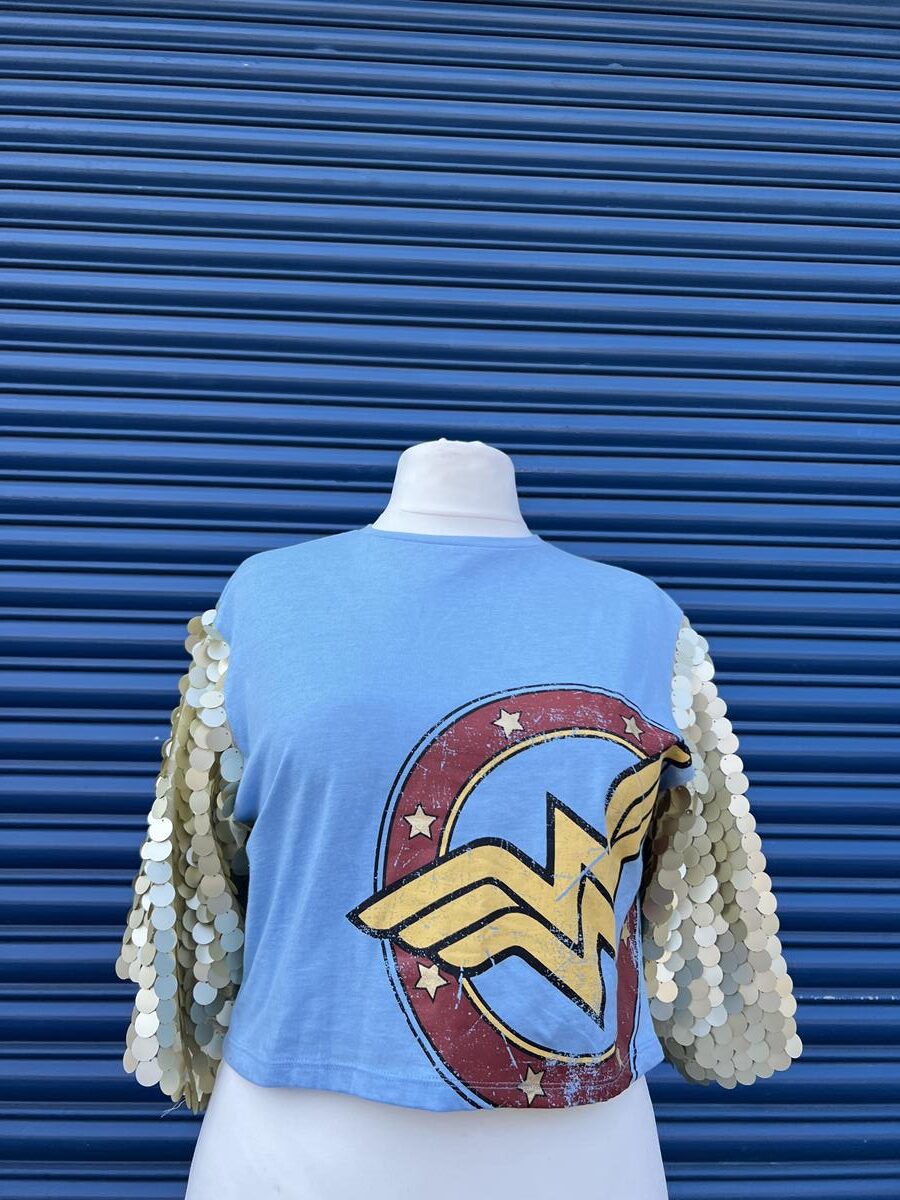 Reworked Baby blue wonder woman t-shirt with gold matt sequin sleeves